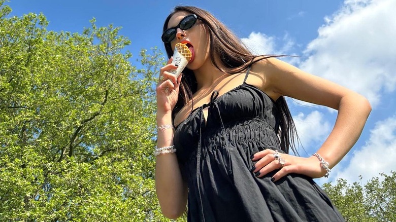 Olivia Rodrigo wearing black milkmaid dress