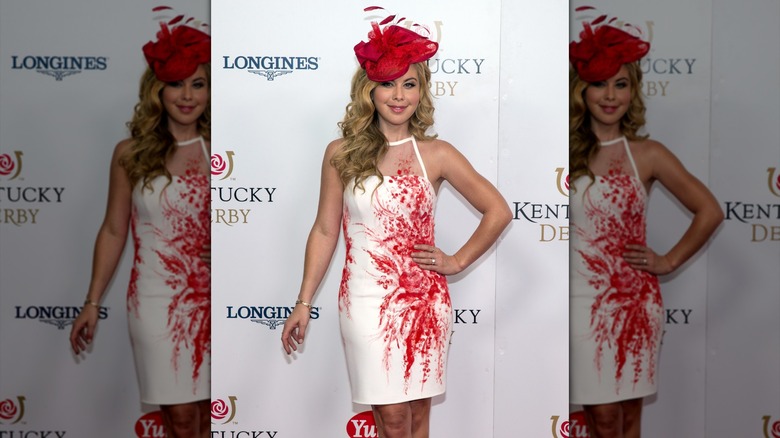 Tara Lipinski smiling in a fascinator at the Kentucky Derby