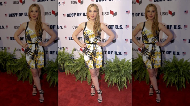 Tara Lipinski in a colorful minidress and strappy sandals