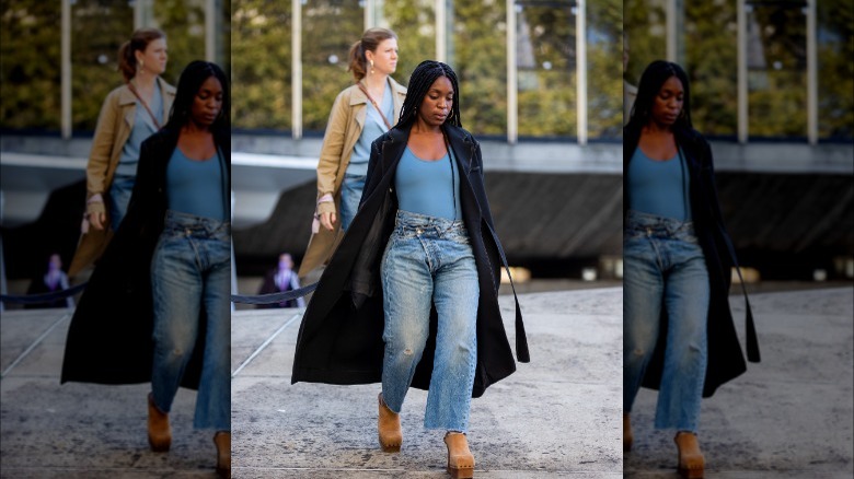 Woman wearing bodysuit and jeans