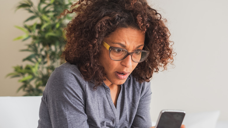 surprised woman on phone