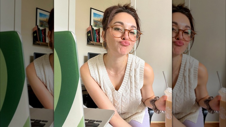 A woman with round glasses