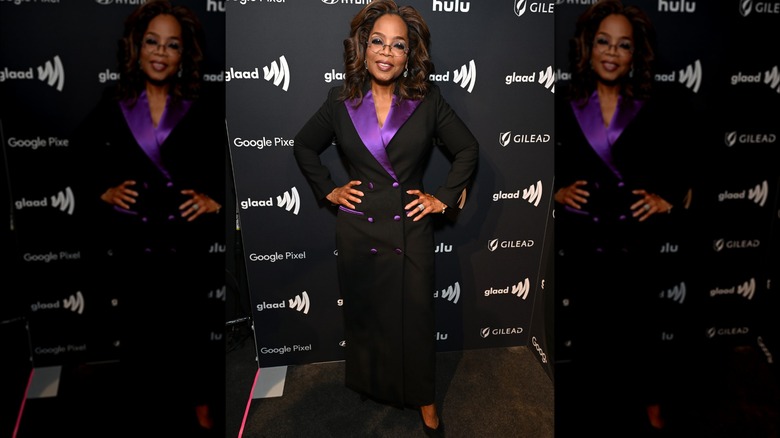 Oprah in black and purple suit