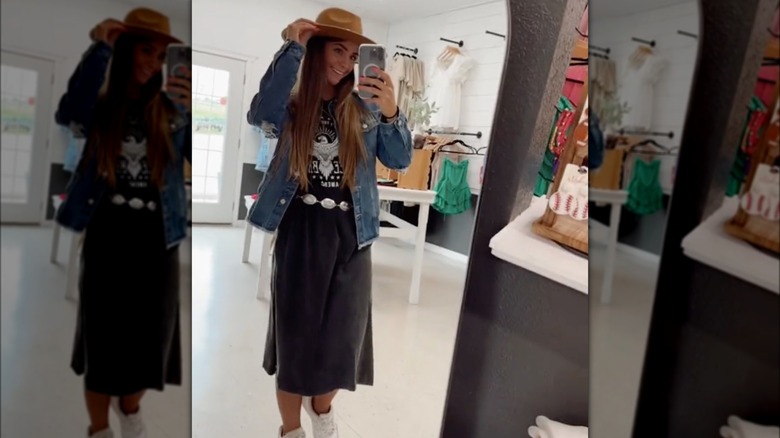 Woman in black maxi and hat