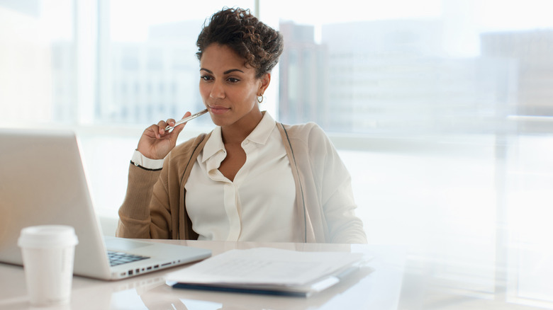 Woman writing at table