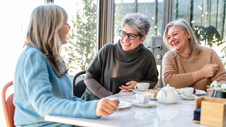 Three women eating and talking