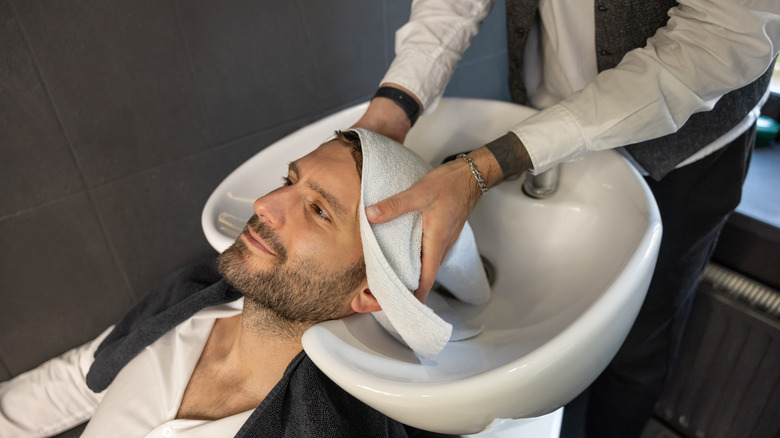 Man with towel on head
