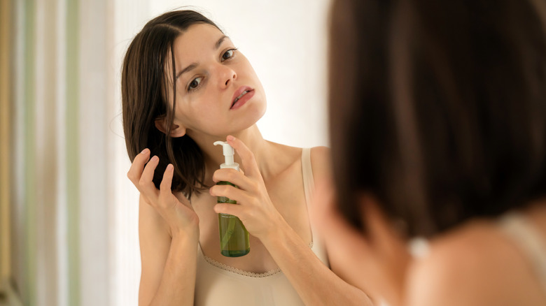 Woman using product in her hair