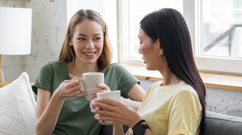 Two women talking with coffee
