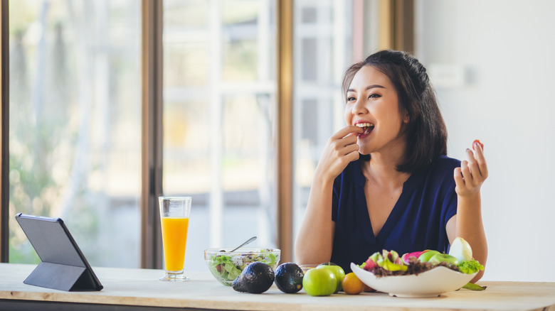 Woman eating healthy salad