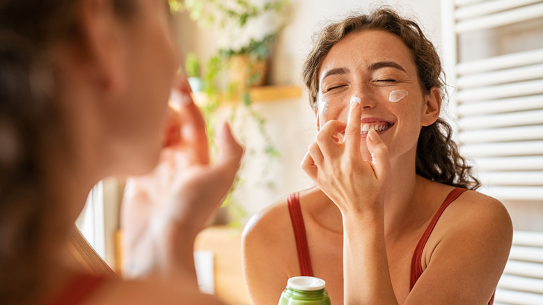 Woman caring for skin on her nose