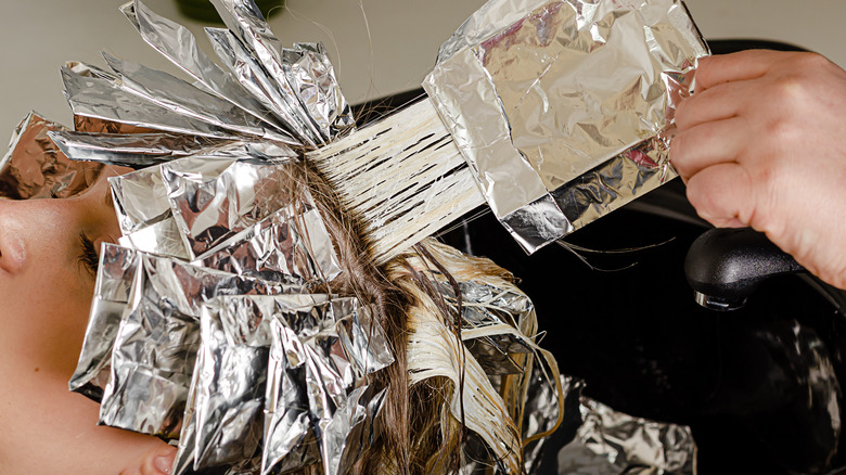 Person having their hair bleached