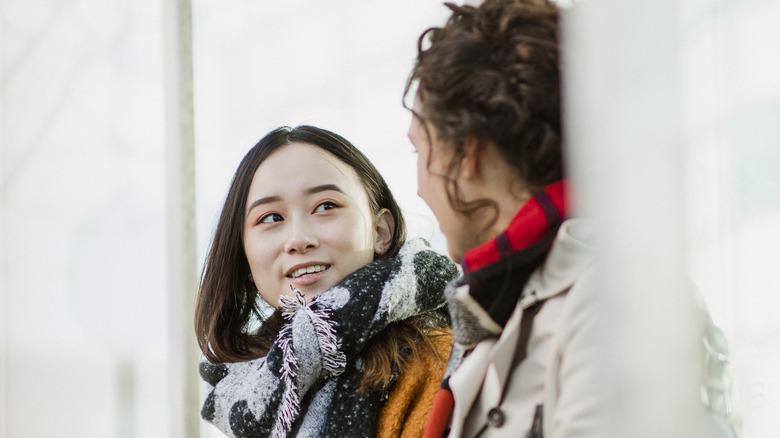Friends talking outside in winter