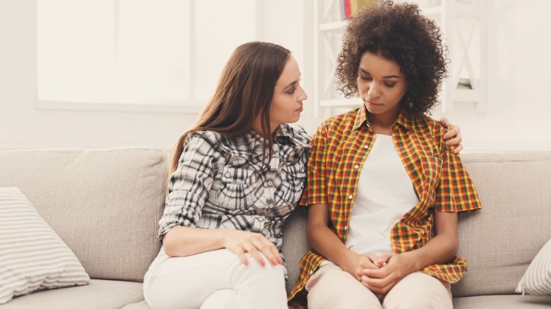Woman comforting her friend
