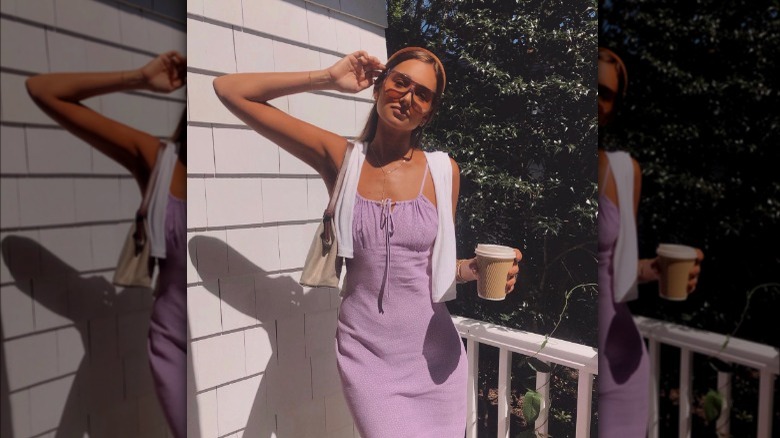 Woman wearing dress and sweater 