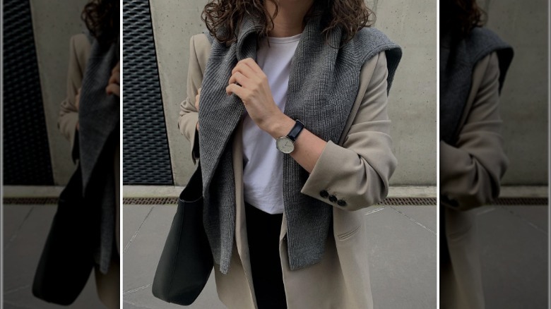 Woman wearing sweater over blazer 