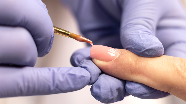 Builder gel being applied to nail