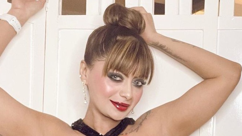 Woman with sleek high bun