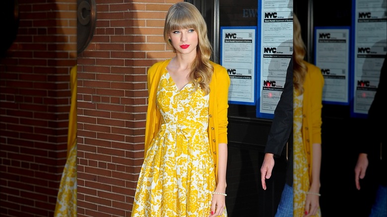 Taylor Swift wearing a cardigan