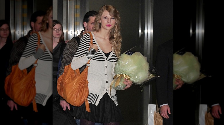 Taylor Swift wearing a cardigan