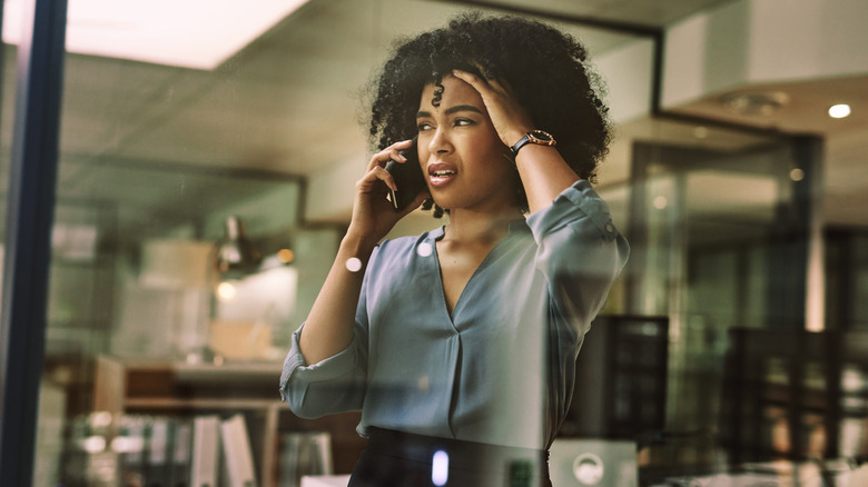 irritated woman speaking on phone