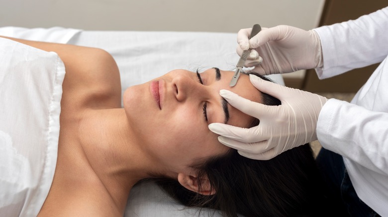 woman getting dermaplaning treatment