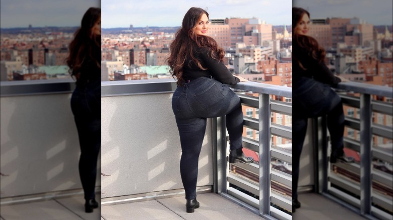 Plus size woman models black jeans
