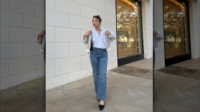 Girl wearing pointed toe flats.