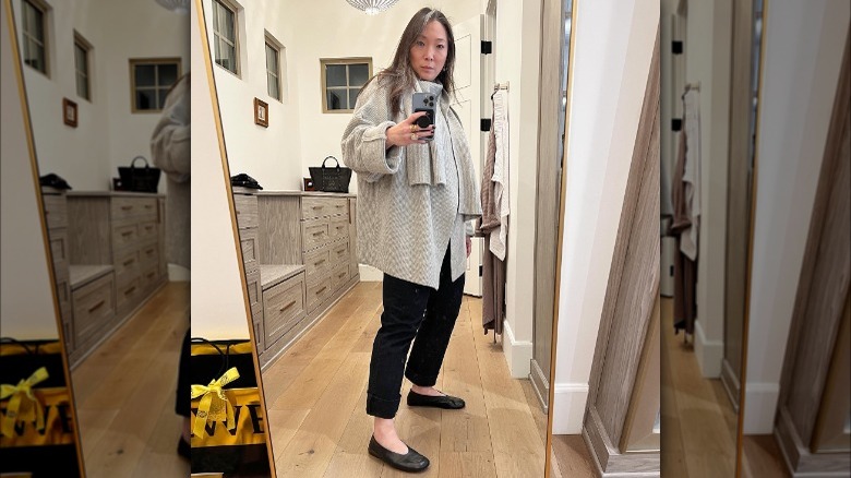 Girl wearing wider leg pants with ballet flats.