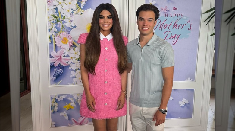 Kimberly Guilfoyle posing with her son in a pink dress