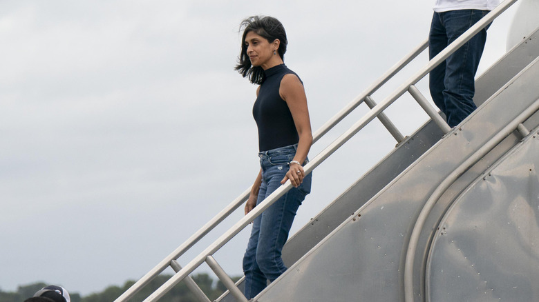 Usha Vance exiting a plane in skinny jeans