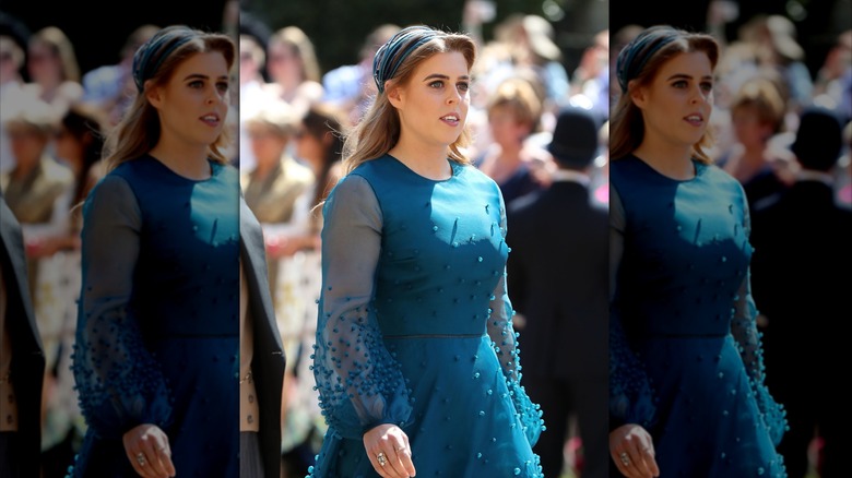 Princess Beatrice in a blue dress with pom poms
