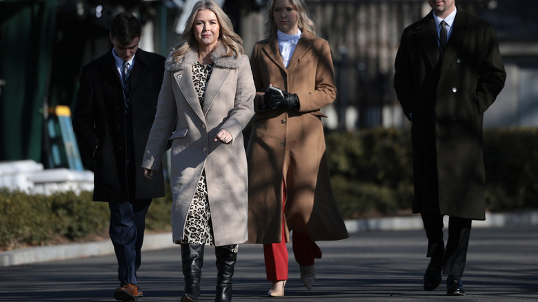 Karoline Leavitt wearing an outfits with too many layers and too little styling