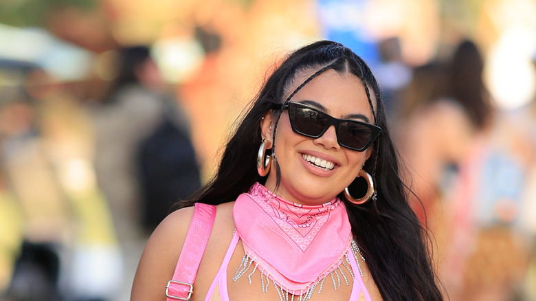 Women at festival smiling