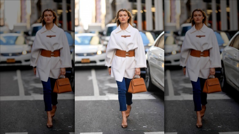 woman wearing brown leather belt