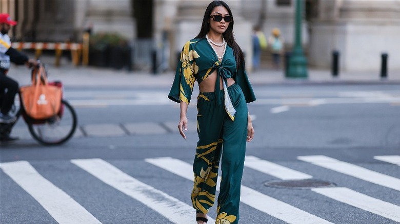 woman wearing green matching floral set