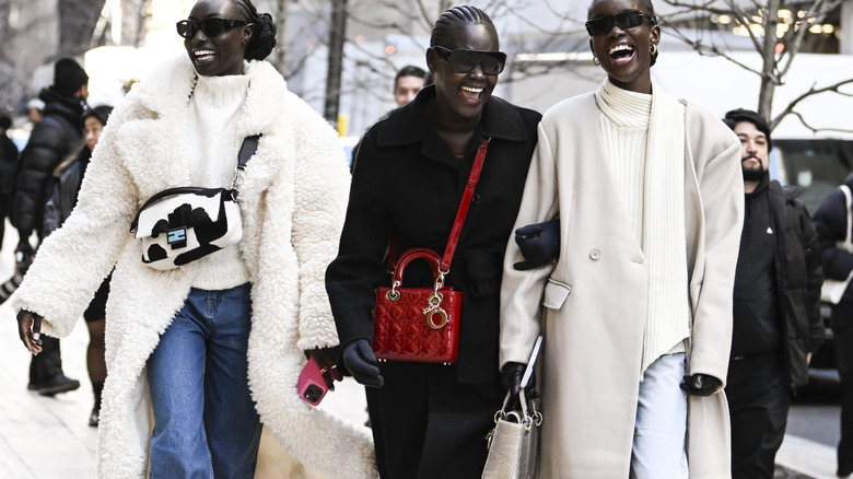 Woman carrying a red bag