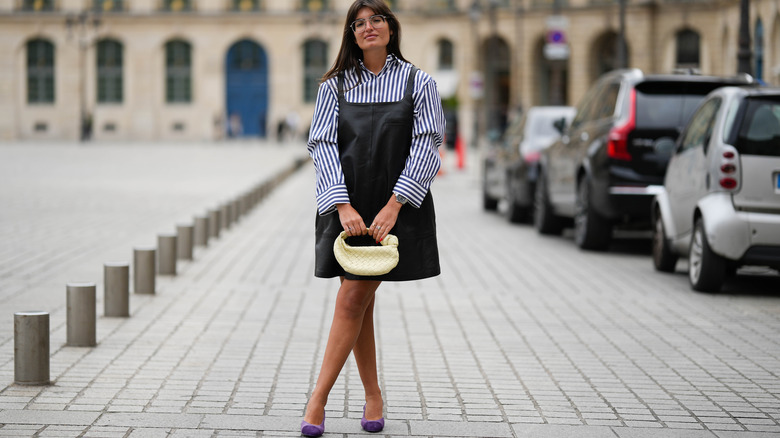 Woman holding yellow bag