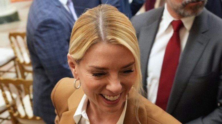 Pam Bondi smiles at the White House
