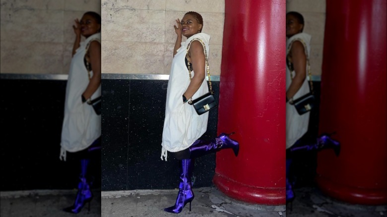 woman wearing pair of purple boots