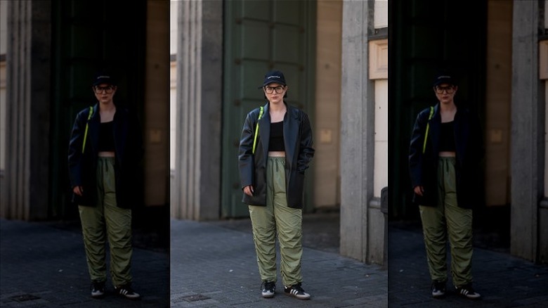 woman wearing green parachute pants