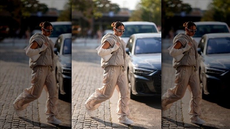 woman wearing neutral parachute pants