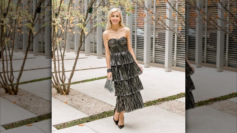 Girl wearing a tiered metallic midi dress