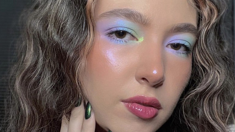 person with rainbow makeup on