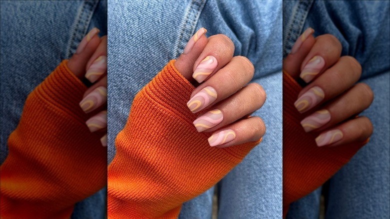 Woman with a swirl nail design