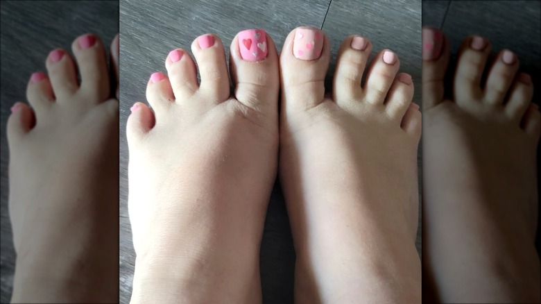 Woman with a heart design pedicure