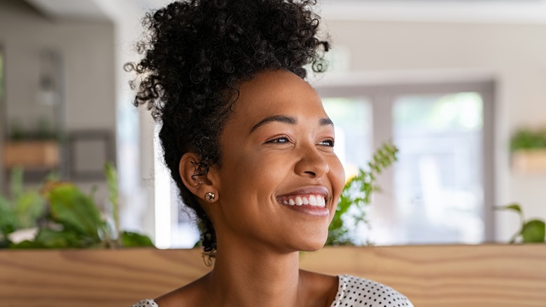 woman thinking happy thoughts