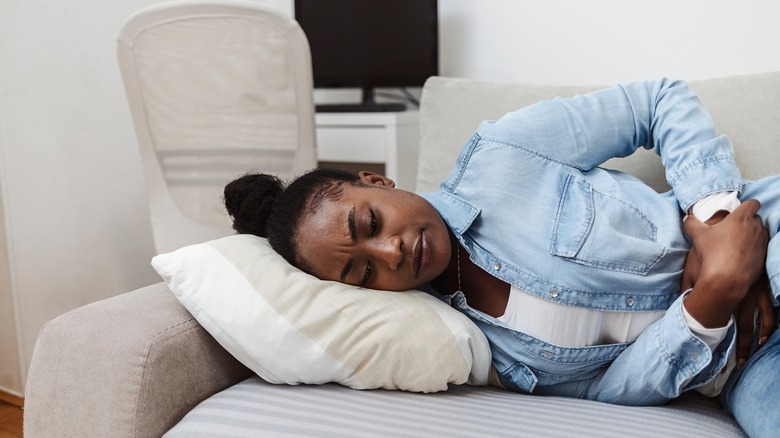 Woman in pain resting