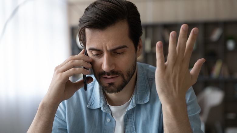 Man upset on phone