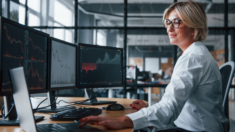 Stockbroker studies market trends